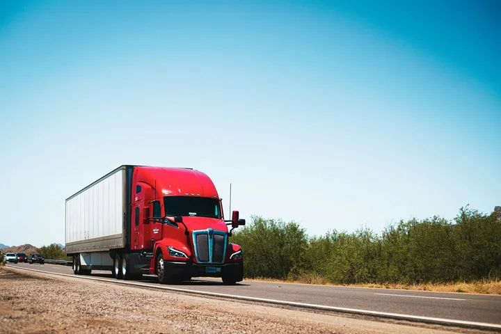 Red truck on an open highway